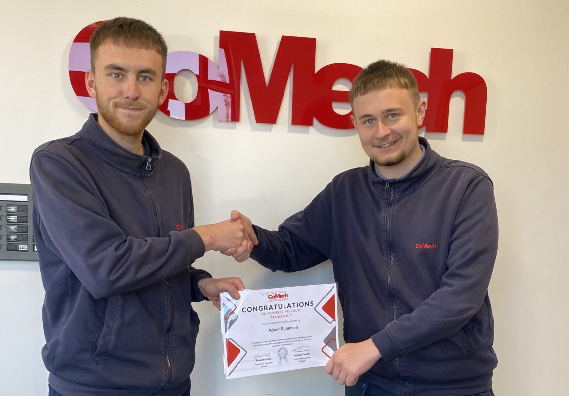 Employee receiving his certificate for completing his traineeship