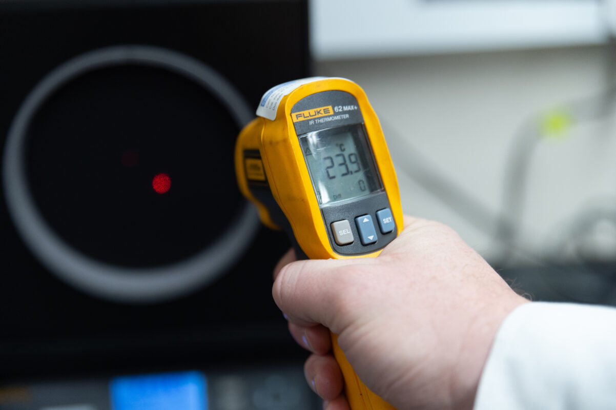 Infra red thermometer taking a reading